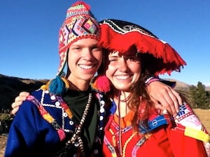 Two girls in costume in Peru