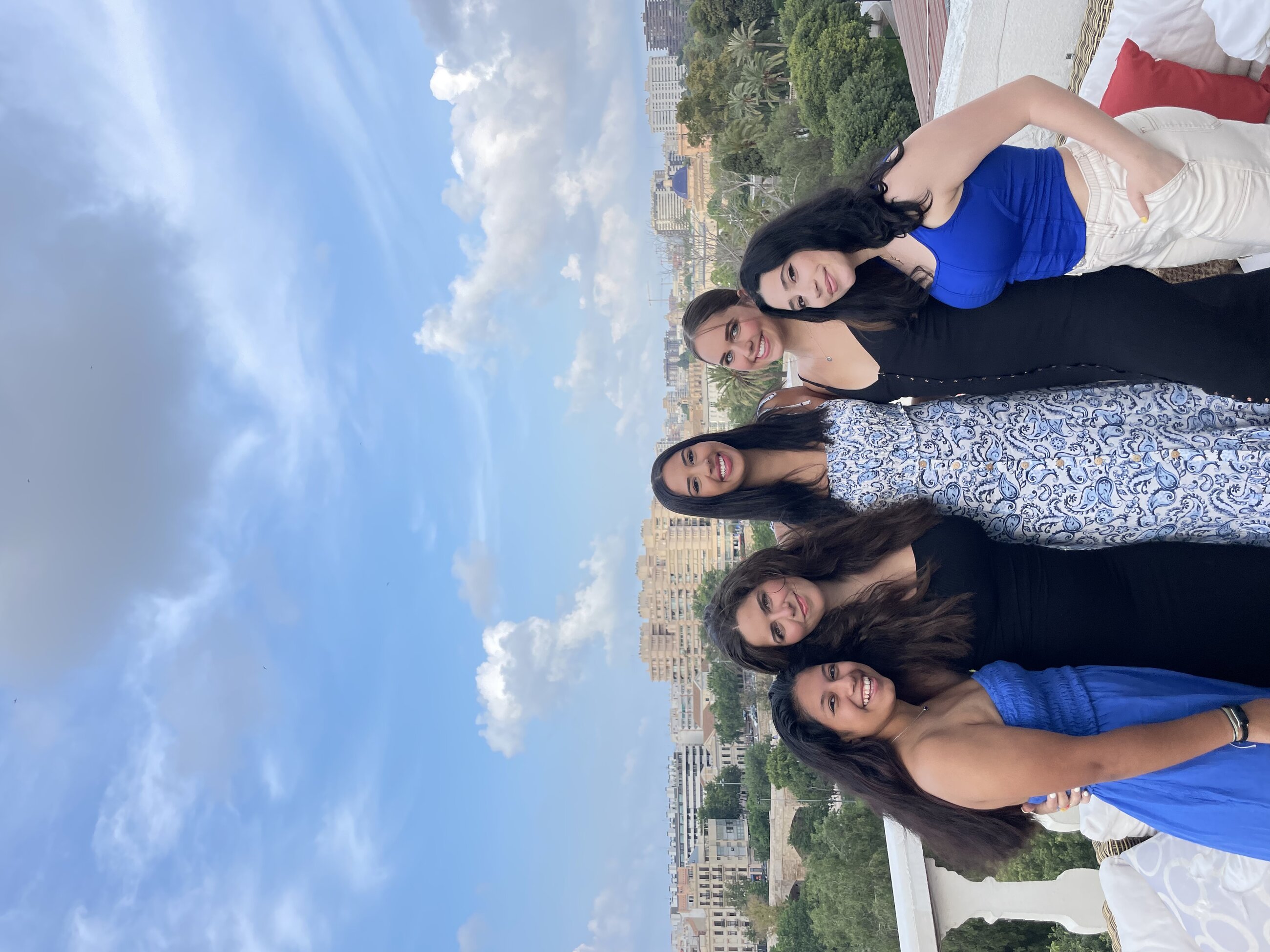 My friends and I enjoying happy hour on a rooftop terrace overlooking the city of Valencia