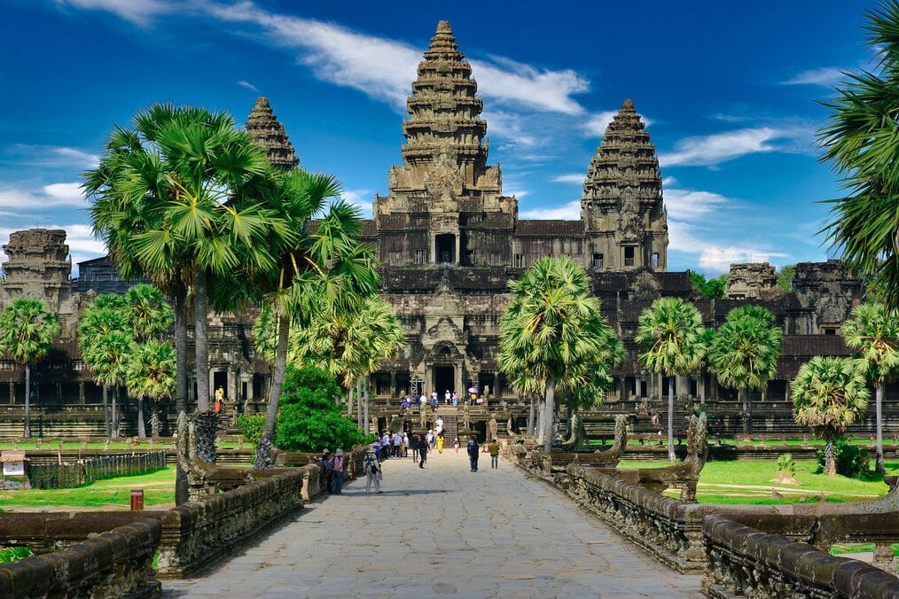 Photo by Paul Szewczyk on Unsplash A crowd of people walk up to Angkor Wat in Cambodia.