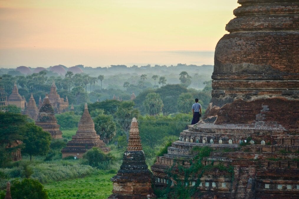 Photo by Sébastien Goldberg on Unsplash Temples dot green hills in Myanmar.