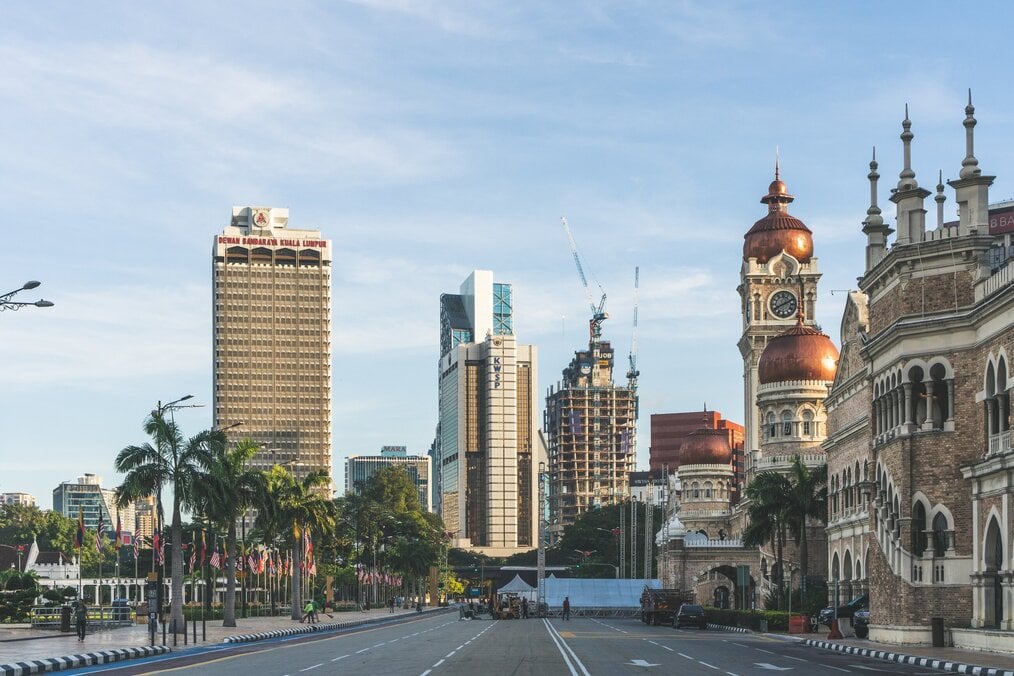 Photo by Sulthan Auliya on Unsplash A street view of buildings in Kuala Lumpur.