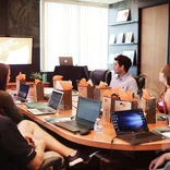 Group sitting around a conference room table