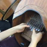 Playing the mbira