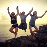 students jumping on 12-day liveaboard program