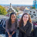 two students sitting on bench in Park Güell in Barcelona, Spain