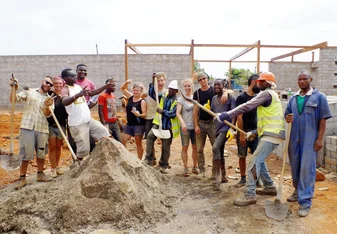 Volunteers on the Rising Education Centre site