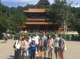 group in front of chinese building