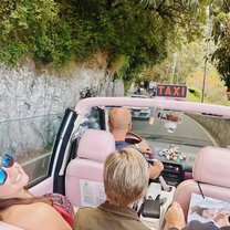 Riding in a pink taxi on the island of Capri